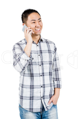 Smiling man using his smartphone