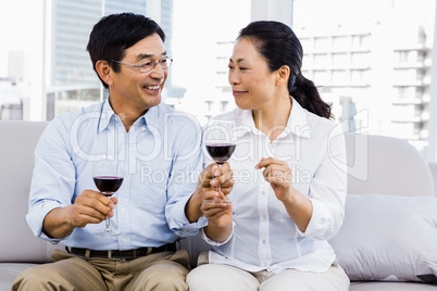 Man and woman with glasses of wine