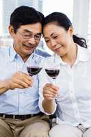 Man and woman with glasses of wine