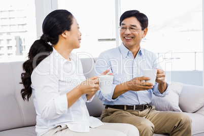 Couple enjoying coffee on the couch