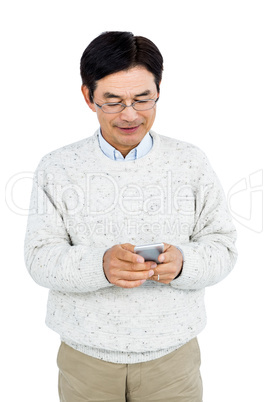 Smiling man using his smartphone