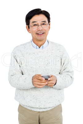 Smiling man using his smartphone