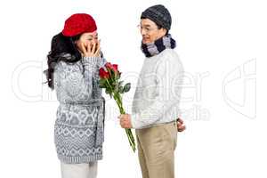 Older asian man giving his wife flowers