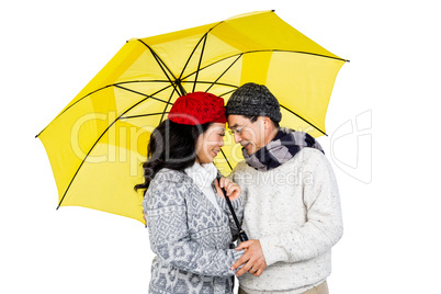 Older asian couple under umbrella