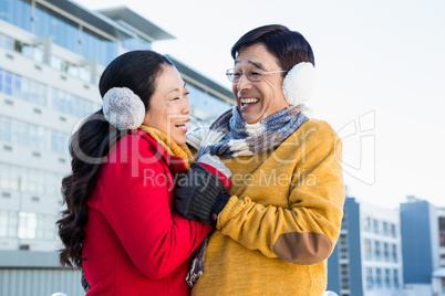 Older asian couple on balcony