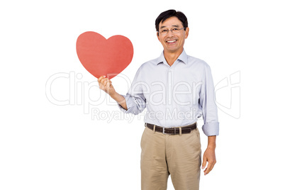 Older asian man showing heart