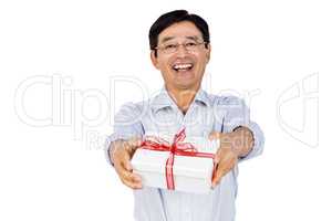 Older asian man giving a gift