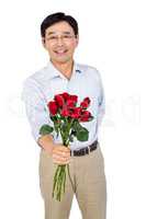 Older asian man offering roses
