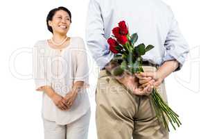 Older asian couple with roses