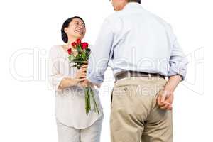 Older asian couple with roses