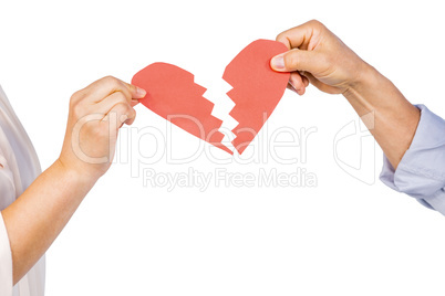 Couple holding broken heart