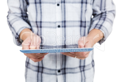 Casual man using tablet pc