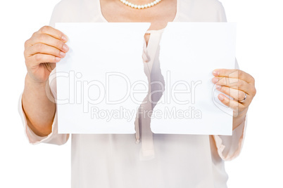 Woman holding ripped page