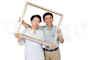 Older asian couple with frame