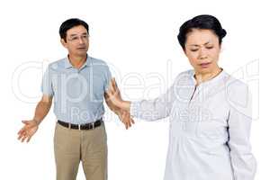 Older asian couple having an argument