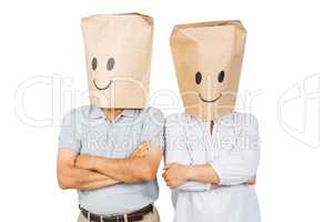 Couple with bags on head