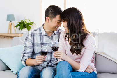 Happy couple drinking wine