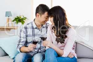 Happy couple drinking wine