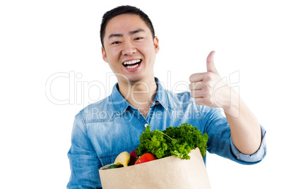 Portrait of man holding bag