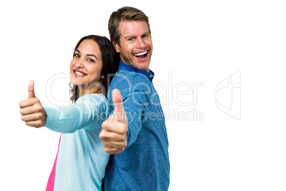 Smiling couple gesturing ok sign