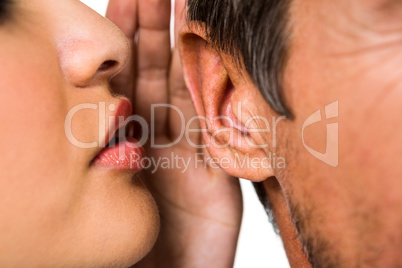 Woman whispering in man ear