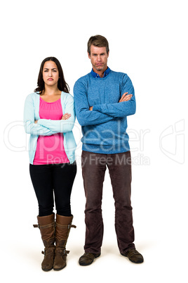 Portrait of couple standing with arms crossed