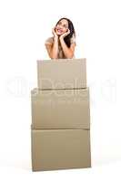 Woman standing with boxes