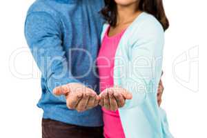 Midsection of couple gesturing