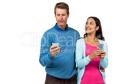 Man and woman using mobile phone