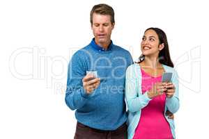 Man and woman using mobile phone