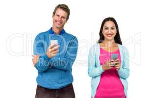 Portrait of man and woman using phone