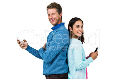 Smiling man and woman using phone