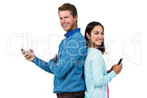 Smiling man and woman using phone