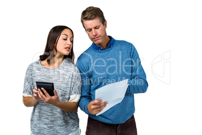 Close-up of man and woman calculating