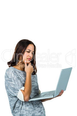Confused woman using laptop
