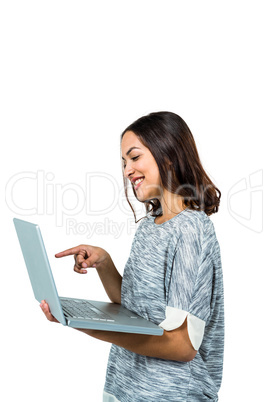Smiling woman pointing at laptop