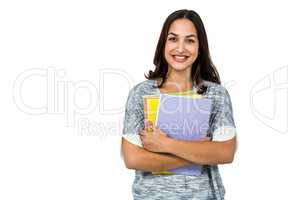 Portrait of smiling woman holding books