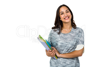 Portrait of happy woman holding books