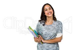 Portrait of happy woman holding books