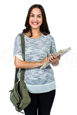 Portrait of smiling woman holding books