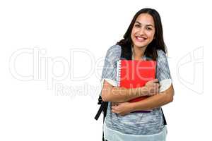 Happy woman holding books