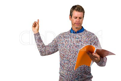 Close-up of man reading book