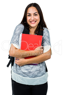 Portrait of happy woman holding books