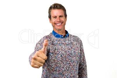 Close-up portrait of happy man showing thumps sign