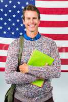 Portrait of happy man standing against American flag