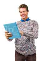 Close-up of smiling man reading book