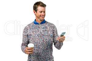 Smiling man using mobile phone