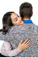 Close-up of woman hugging man