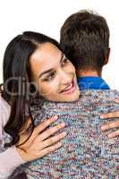 Close-up of woman hugging man