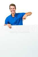 Smiling man holding board